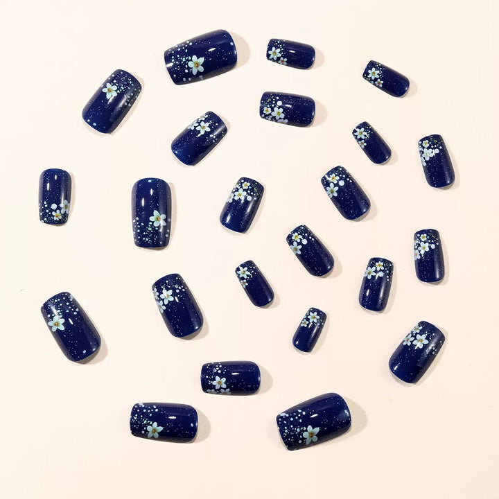 Acrylic nail set with elegant flower design and glitter accents Stornfield