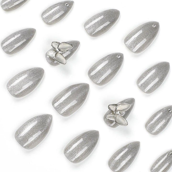 Glamorous stiletto nails with radiant glitter and elegant 3D design Stornfield