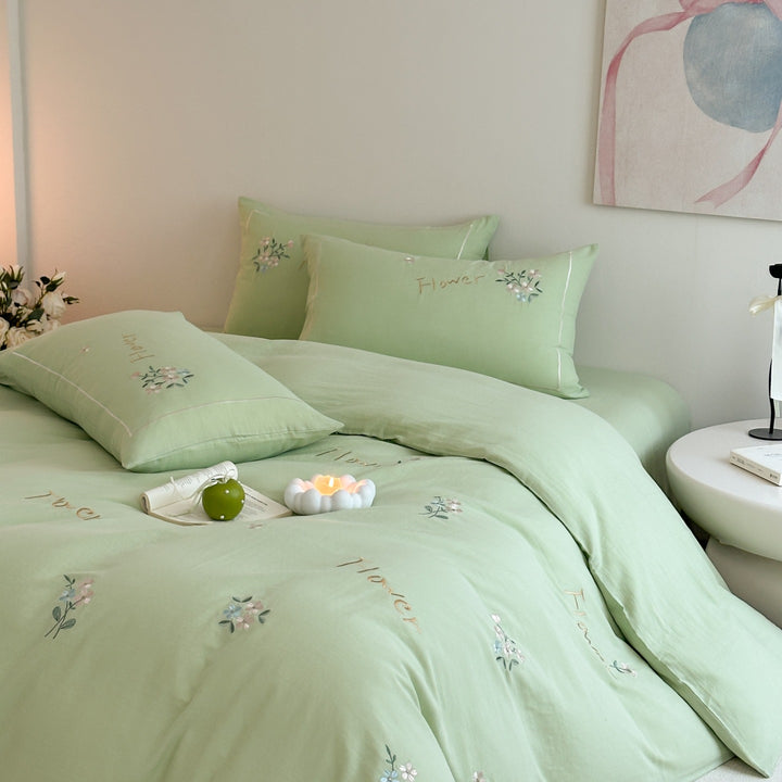Delicate embroidered cotton bedding set with gentle botanical embroidery and bow ties Stornfield