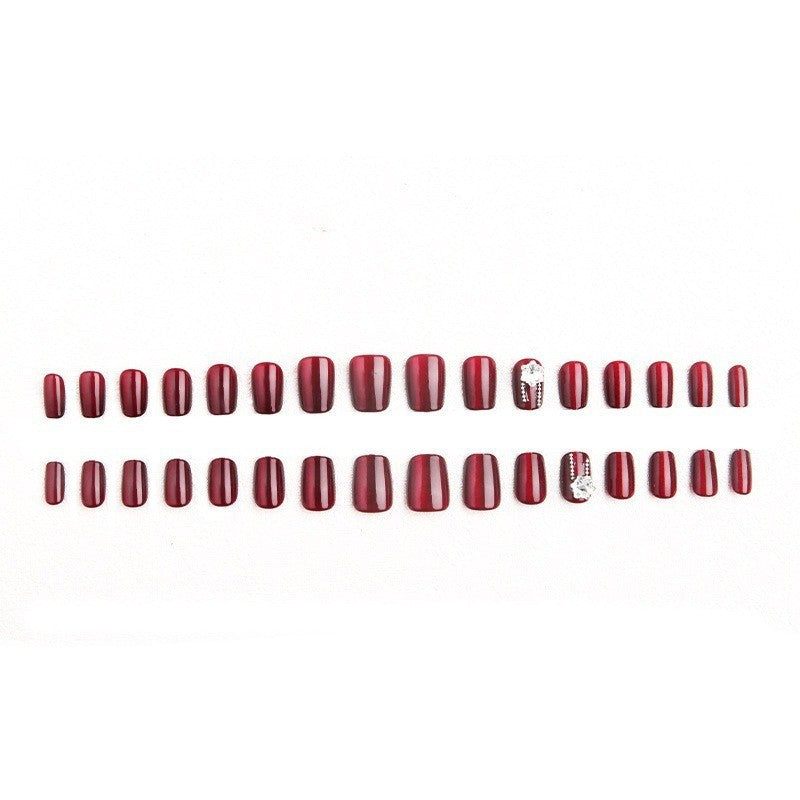 Artificial nail set with sparkling accents and glamorous design Stornfield