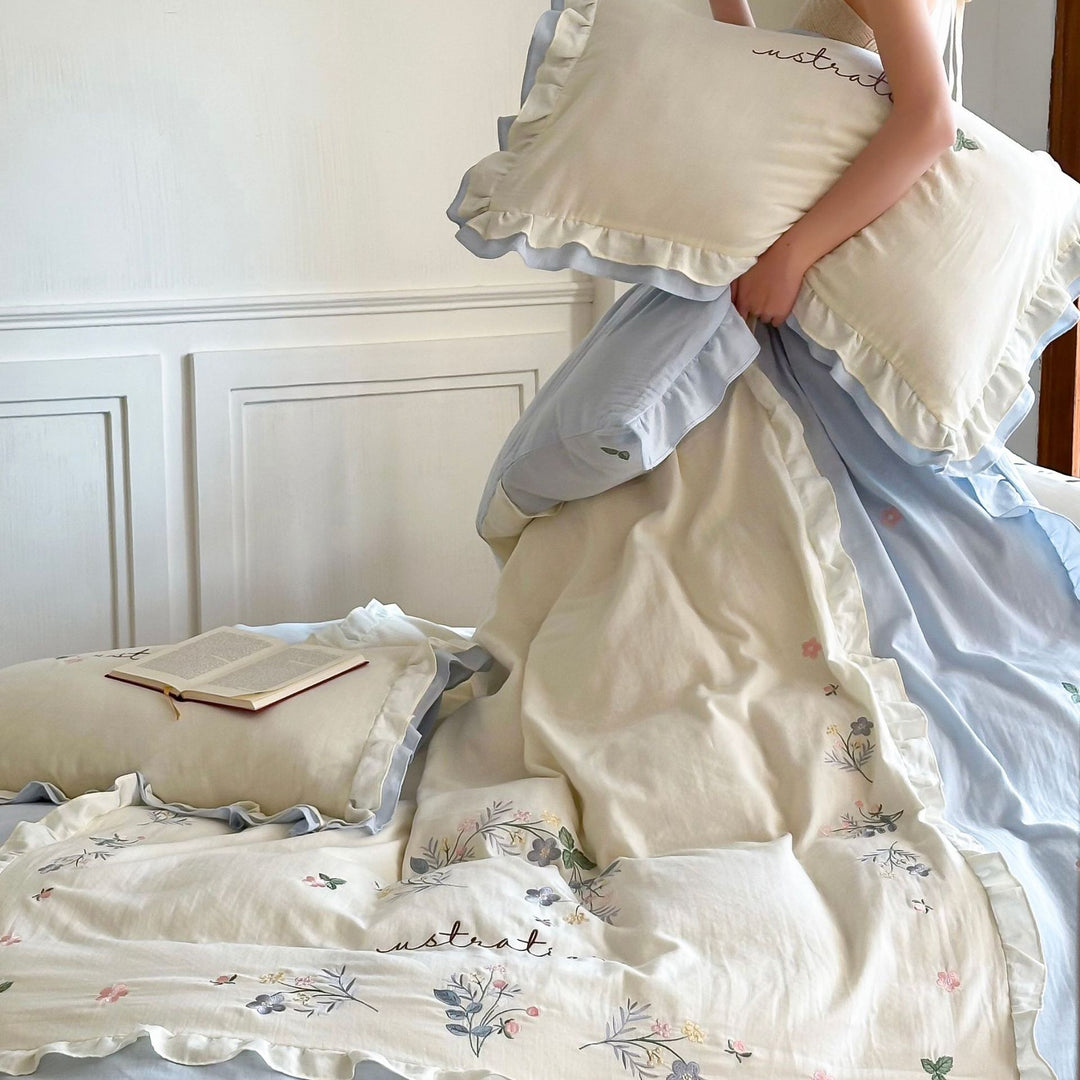 Cotton bedding set in country house style with ruffle edge and fine floral embroidery Stornfield