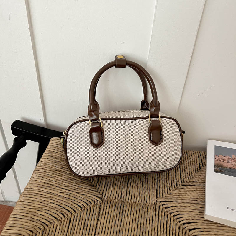 Vintage-Inspired Glossy Handheld Satchel