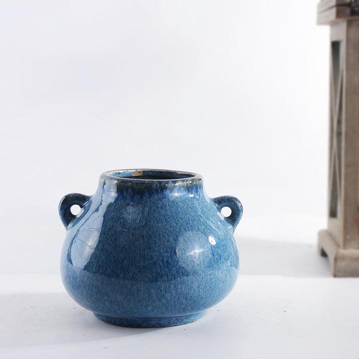 Decorative ceramic pot with playful handles Stornfield