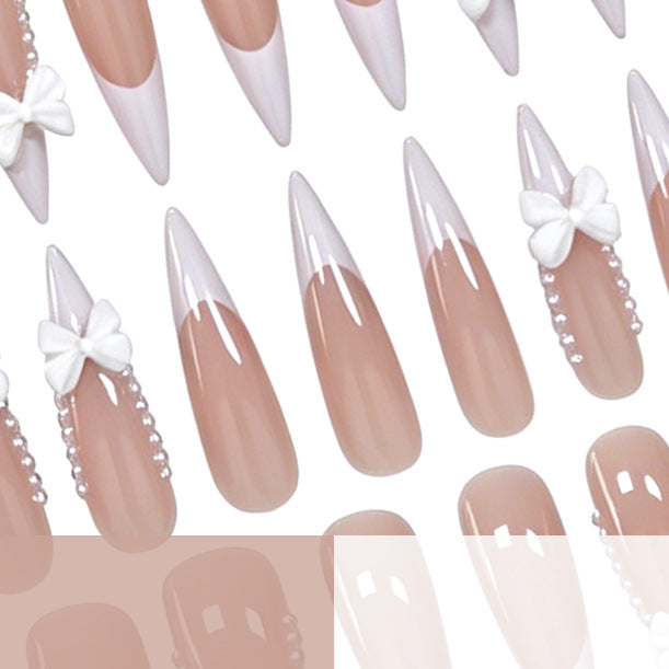 Elegant Bow-Embellished Nail Art Stornfield