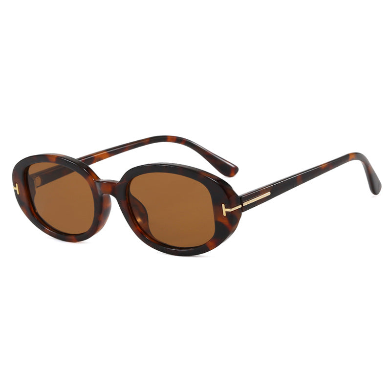 Ladies stylish oval sunglasses with golden details Stornfield