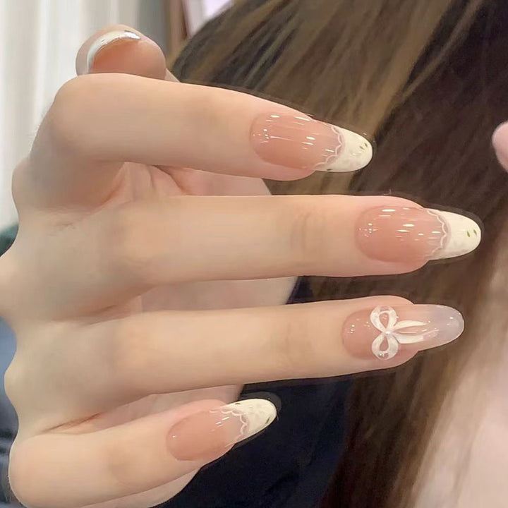 Artificial nails with elegant tip embellishment and romantic details Stornfield