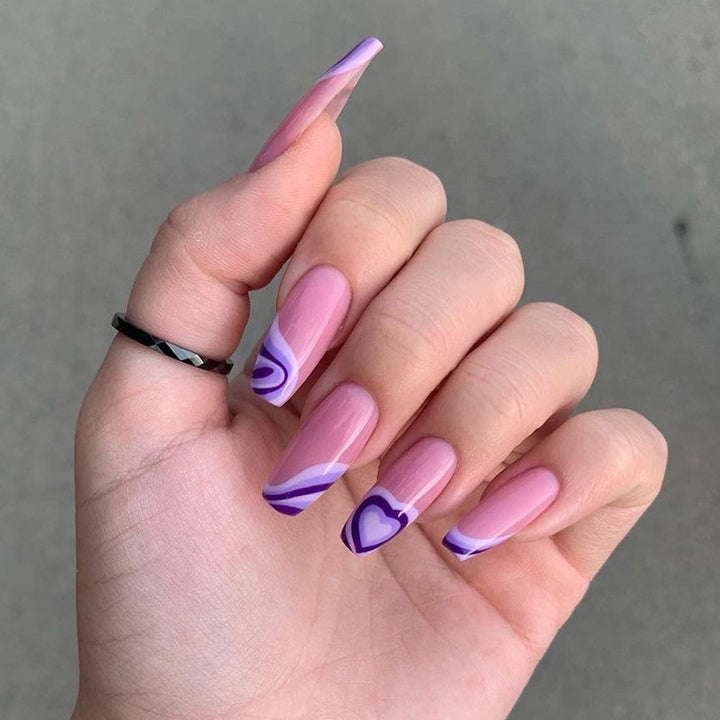Artistic acrylic nails with creative heart and wave patterns Stornfield