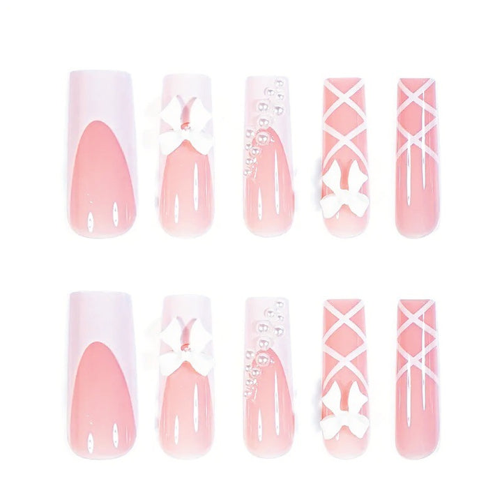 Artificial nail set with elegant 3D bows and pearl embellishments Stornfield