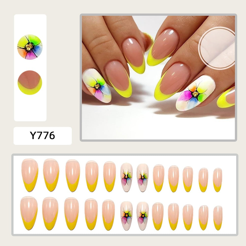 Artificial nails with colorful floral designs and striking color accents Stornfield