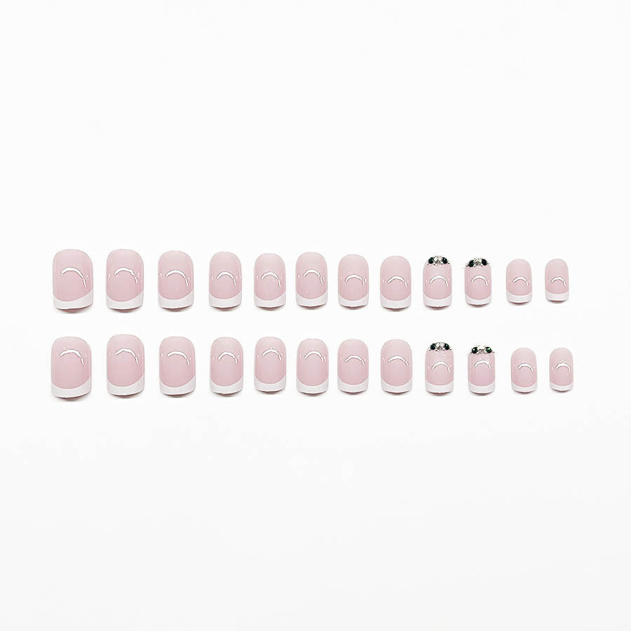 Art nail set with elegant French design and glittering accents Stornfield