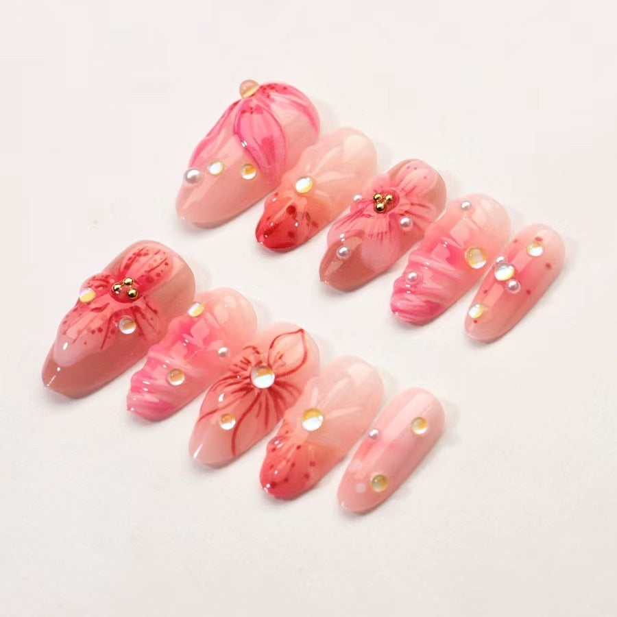 Artificial nail set with floral designs and sparkling accents Stornfield