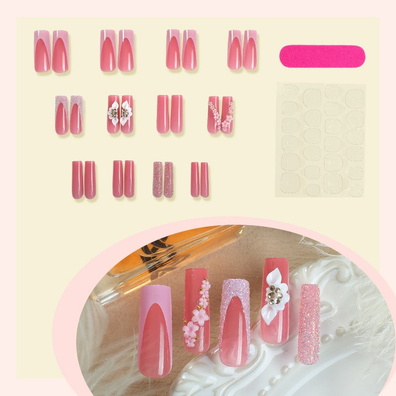 Artificial nail set with romantic floral and glitter elements Stornfield
