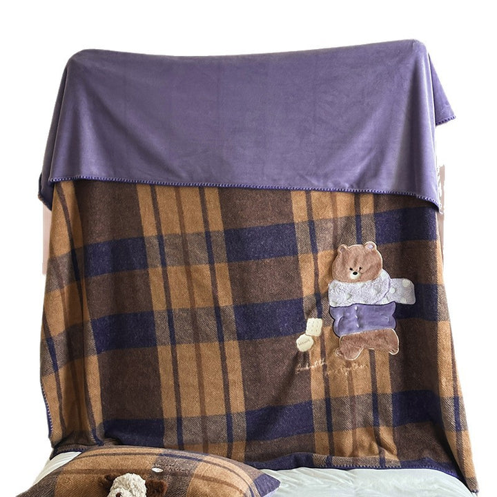 Plaid blanket checkered with appliqued animal motifs and soft velour lining