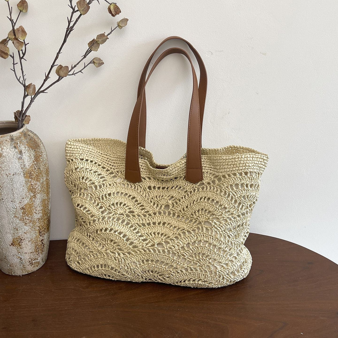 Handbag made of high-quality woven natural material with elegant leather handles Stornfield