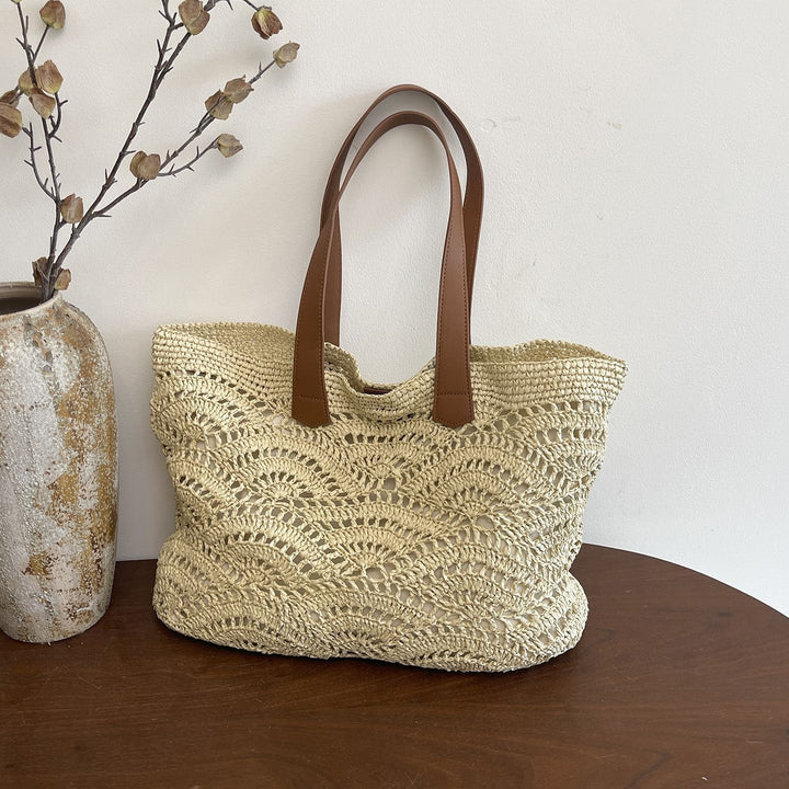Handbag made of high-quality woven natural material with elegant leather handles Stornfield