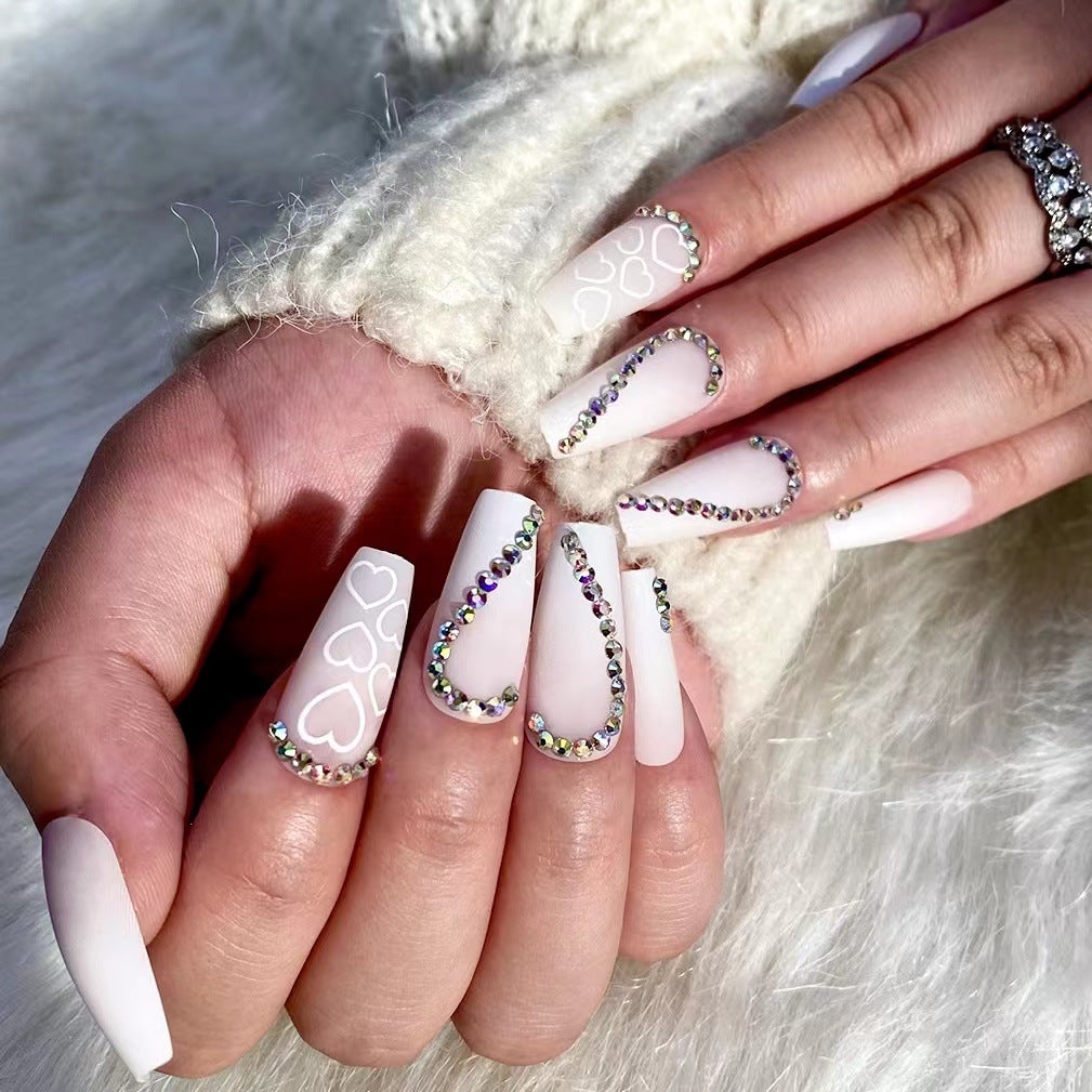 Artful Nail Extensions with Heart Design and Glitter Accents Stornfield