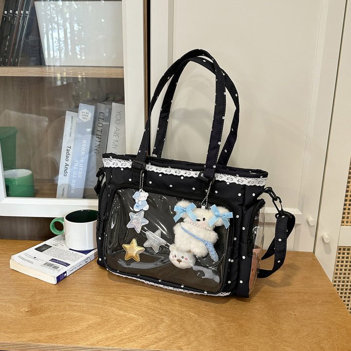 Handbag with Transparent Compartment Division and Playful Application Design Stornfield