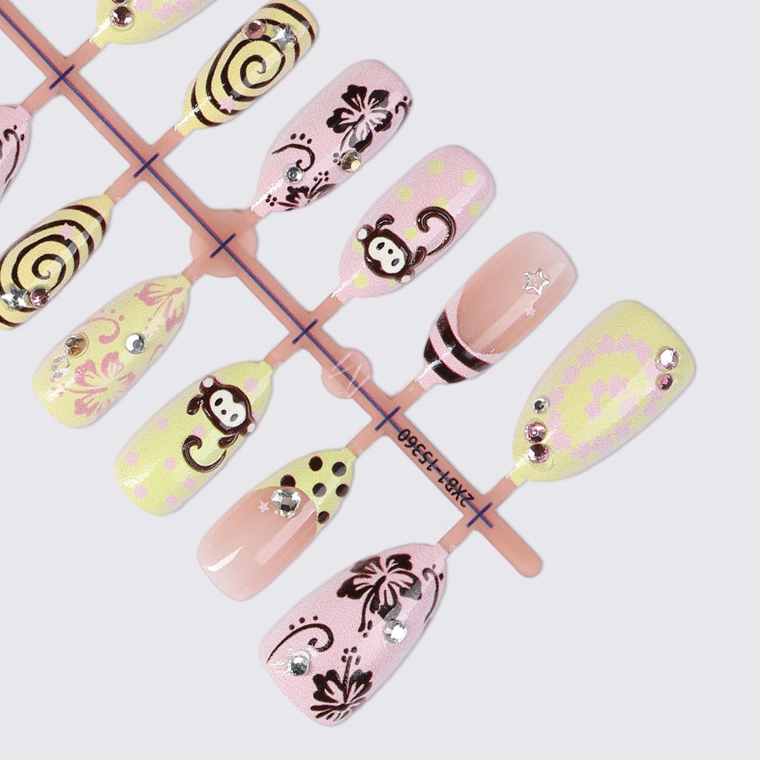 Creative nail art set with playful monkey designs and glitter details Stornfield