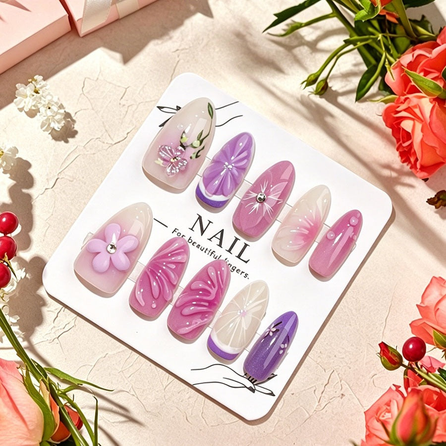 Decorative artificial nails with floral designs and glitter accents Stornfield