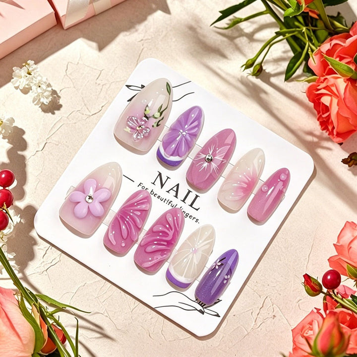 Decorative artificial nails with floral designs and glitter accents Stornfield