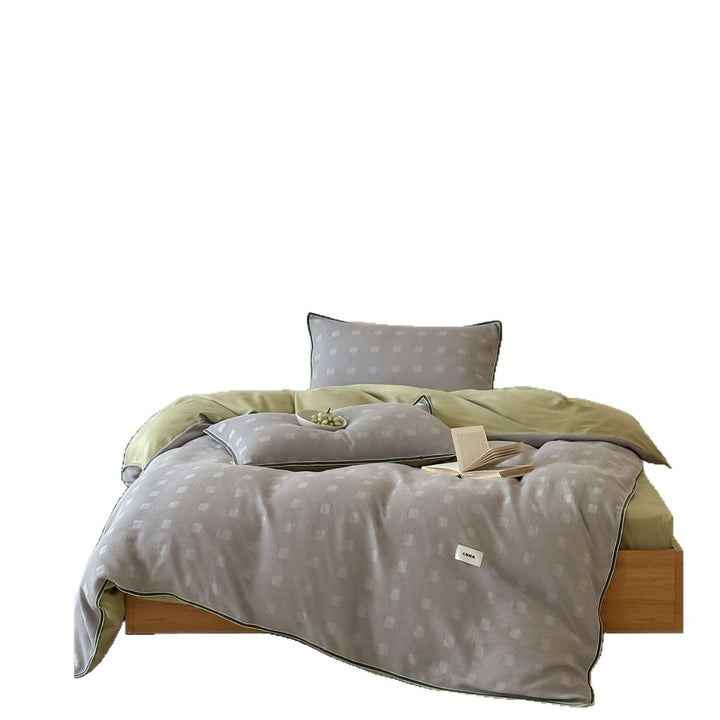 Reversible cotton bedding set with subtle square structure and contrast piping