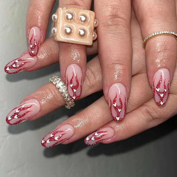 Artificial nail art with romantic heart and flame design Stornfield