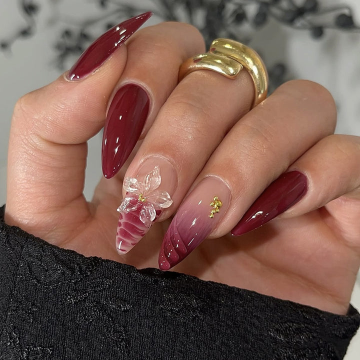 Artificial nail set with modern stiletto design and impressive flower appliqué Stornfield