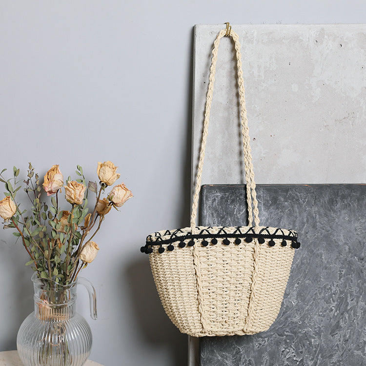 Delicate beach bag with pompons Stornfield