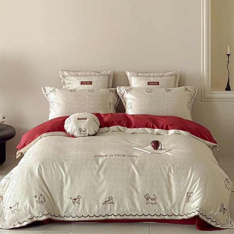 Satin bed linen set with shiny finish, featuring a two-color reversible function and animal embroidery