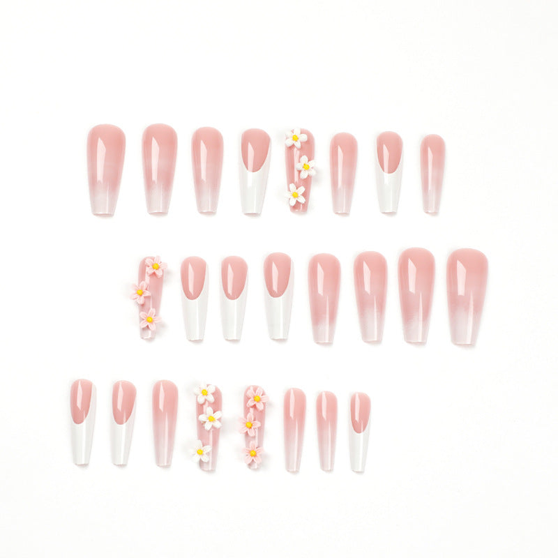 Artful nail extensions with elegant gradient and creative floral accents Stornfield