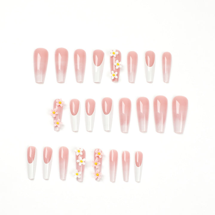 Artful nail extensions with elegant gradient and creative floral accents Stornfield