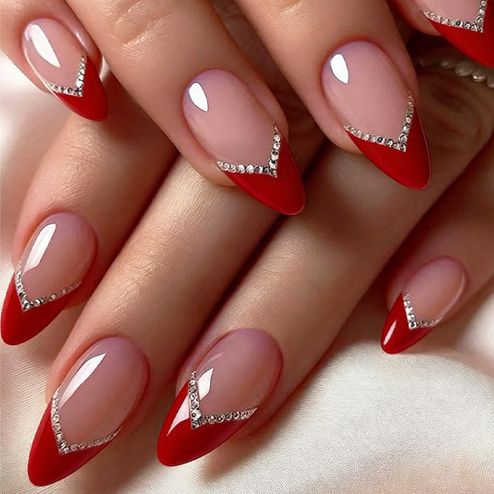 Nail art set with elegant red accents and rhinestone embellishments Stornfield