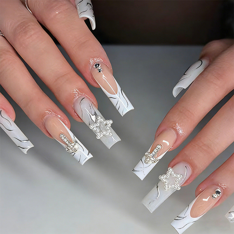 Artificial nails with luxurious marble design and radiant embellishments Stornfield