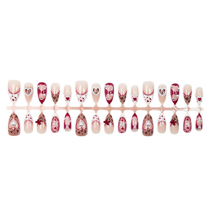 Nail set with romantic heart and bow decorations Stornfield