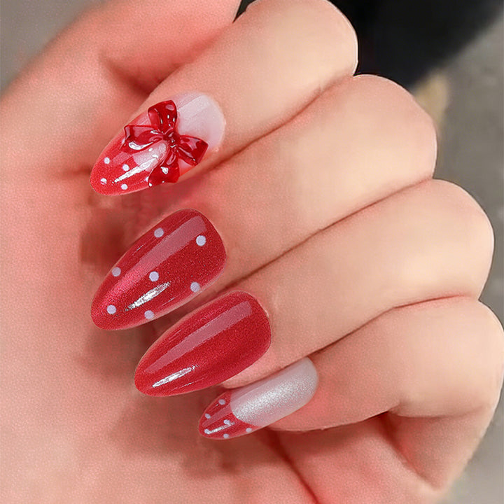 Nail set with playful red polka dots and bow accents Stornfield