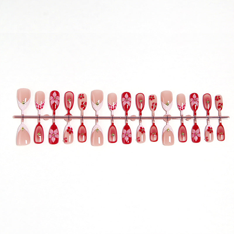 Artificial nails with floral design and glamorous accents Stornfield
