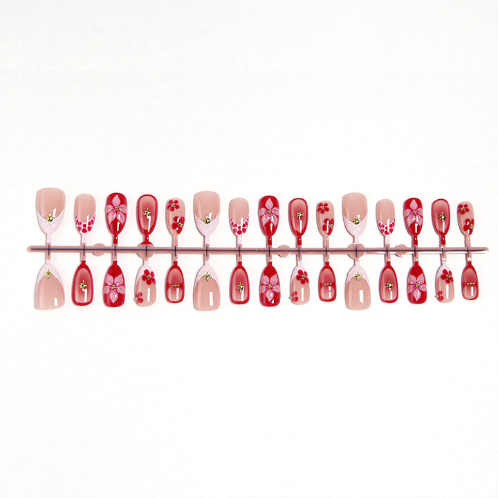 Artificial nails with floral design and glamorous accents Stornfield