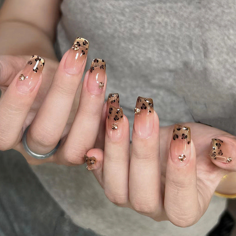 Artificial nails with shimmering leopard design and elegant accents Stornfield