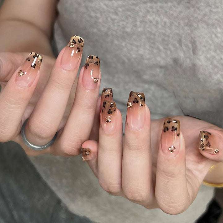 Artificial nails with shimmering leopard design and elegant accents Stornfield