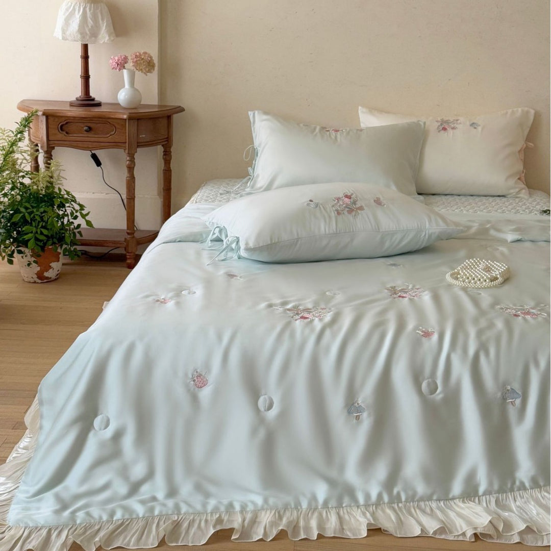 Romantic satin bedding set with ruffle, floral embroidery and tie pillow