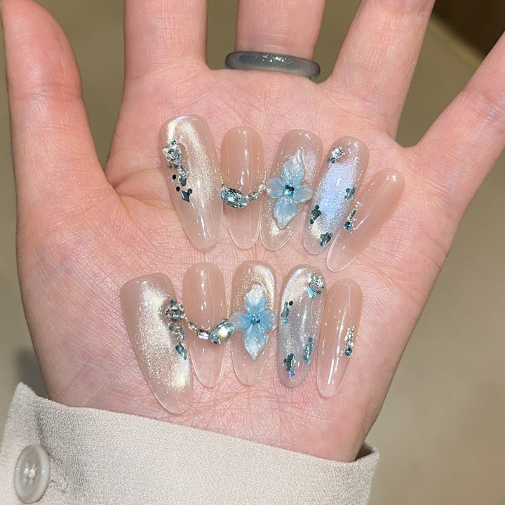 Artificial nails with unique floral design and glitter accents Stornfield