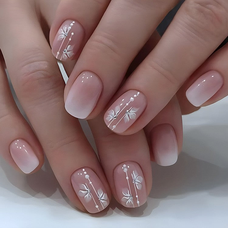 Elegant Artificial Nails with French Manicure and Glitter Effects Stornfield