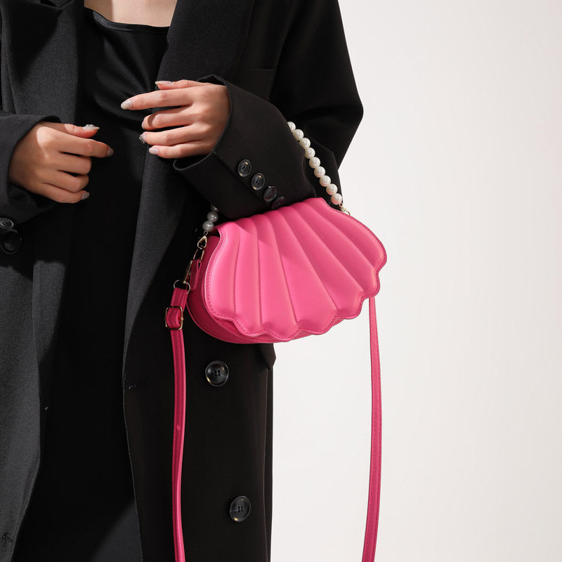 Elegant Pearl-Handled Clutch