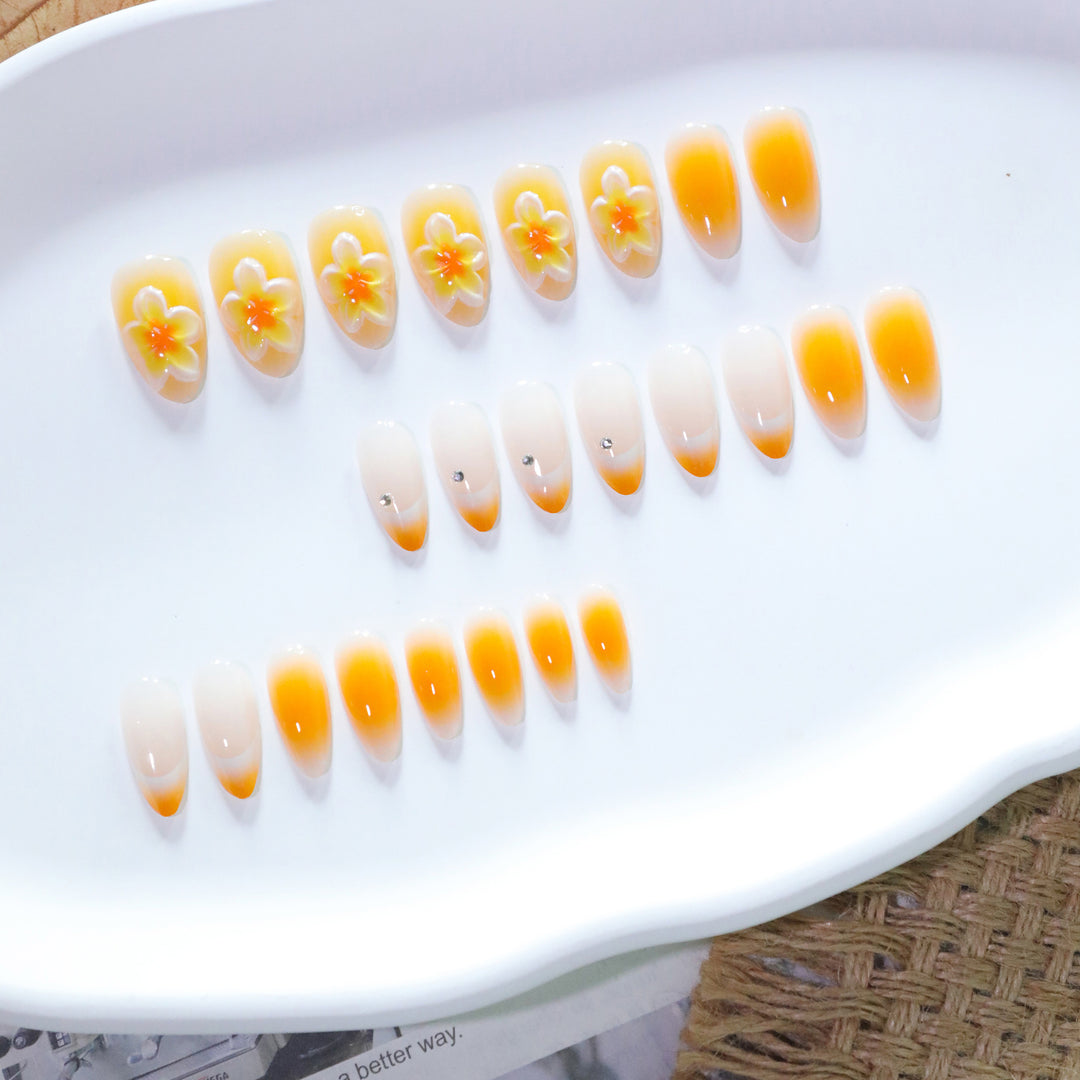 Artful nail extensions with delicate ombre effect and floral accents Stornfield