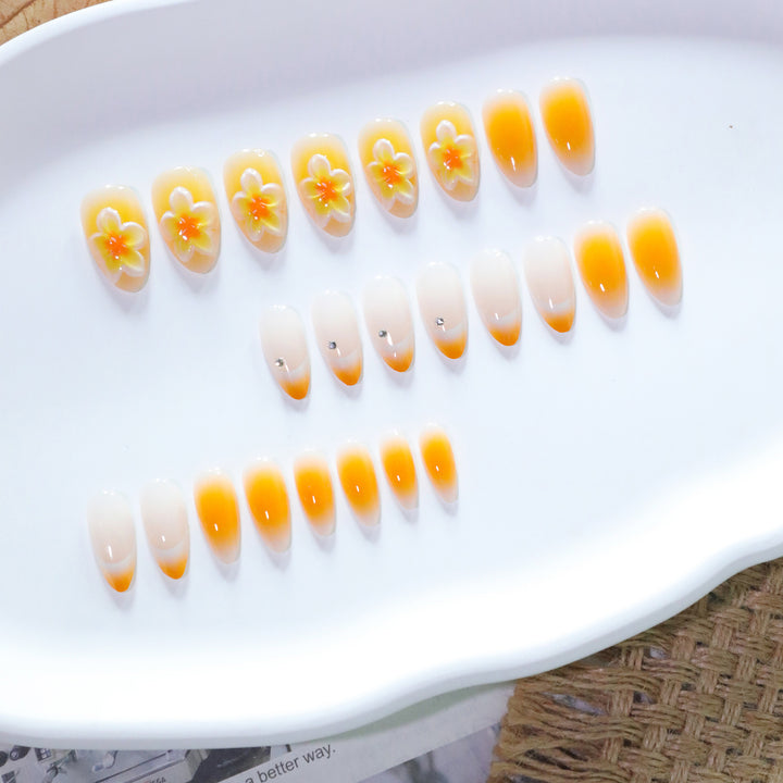 Artful nail extensions with delicate ombre effect and floral accents Stornfield