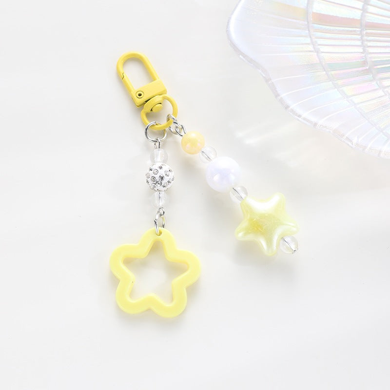 Playful keychain with floral and star motif Stornfield