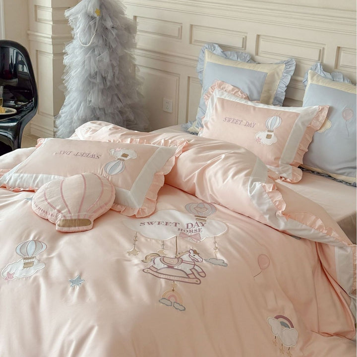 Bedding set in vintage girl style with ruffled hem, hot air balloon applique, and extra soft satin