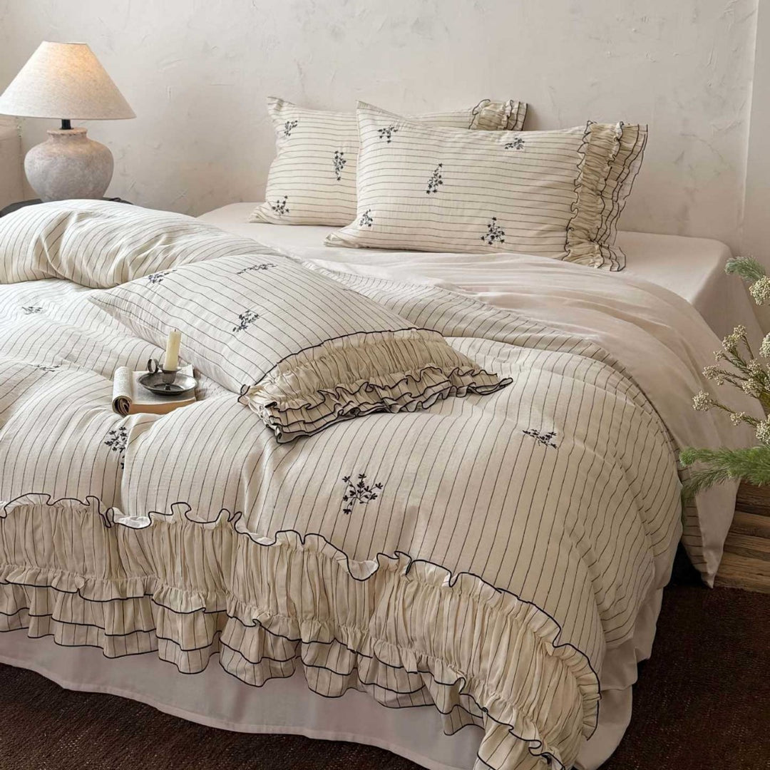 Romantic bedding set with ruffle, fine floral embroidery and pinstripes