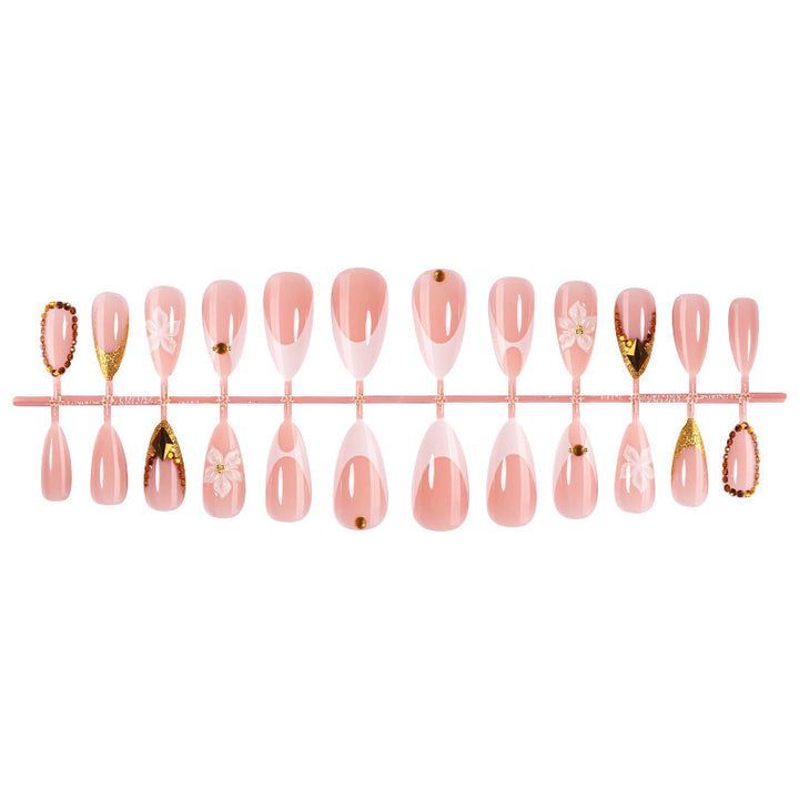 Artificial nail set with elegant flower and gold accents Stornfield