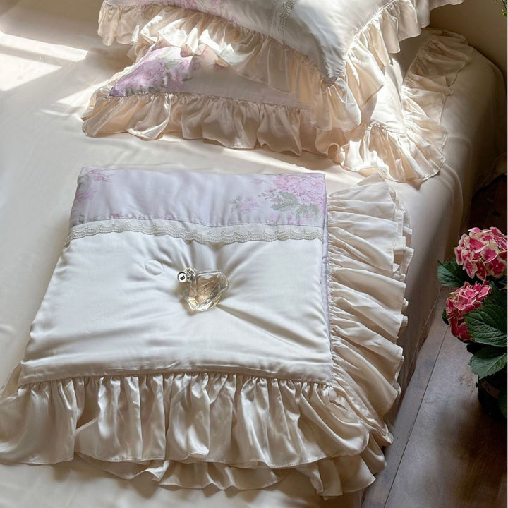 Ruffled satin pillowcase with flounce, lace border, and floral insert